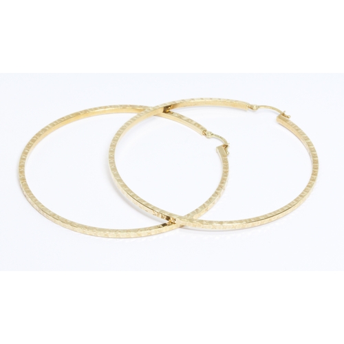 17 - A pair of 9ct gold large hoop earrings, convention marks, diameter 60mm, weight 5.6g.
