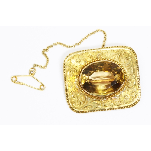 2 - An antique citrine brooch, the bezel set oval mixed cut stone weighing 10.57ct, engraved rectangular... 
