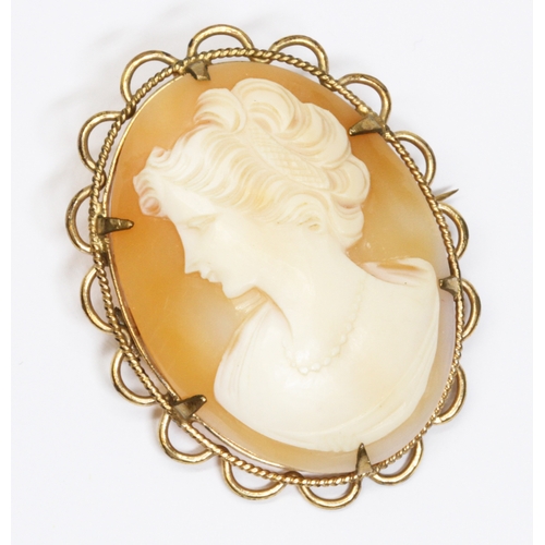 3 - A yellow metal mounted shell cameo brooch, unmarked, length 45mm, gross weight 9.9g.
