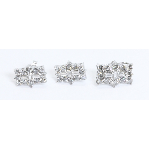 36 - A diamond cluster pendant and pair of matching earrings, all marked '9K', gross weight 4.1g.