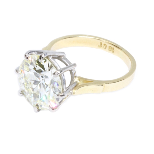 57 - A diamond solitaire ring, the round brilliant cut stone weighing approx. 4.80ct, the approximate qua... 