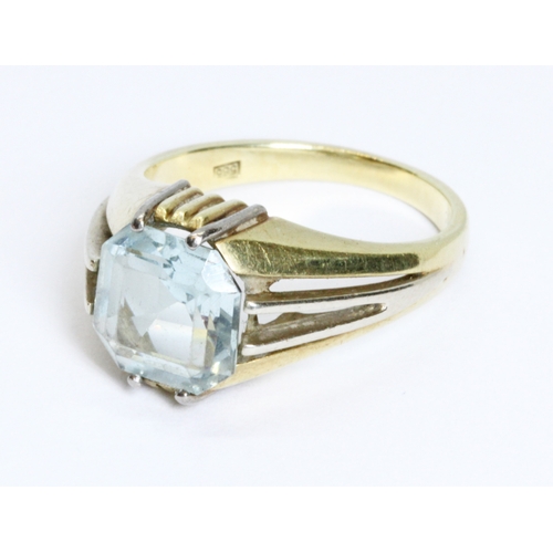 60 - An aquamarine signet ring, the octagonal step cut stone measuring approximately 8.88mm x 8.96mm and ... 