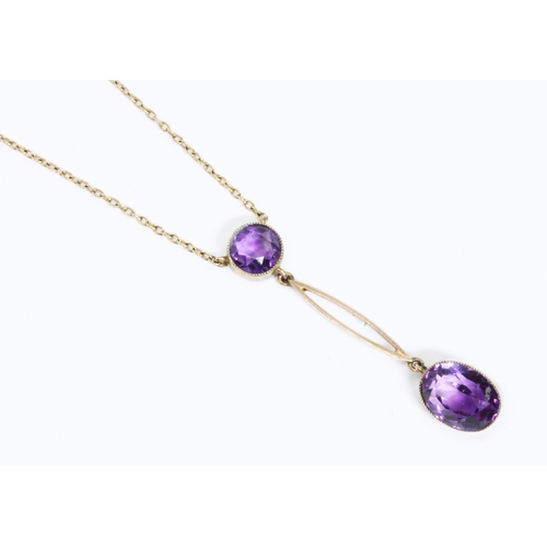 7 - An antique amethyst negligee drop pendant, length 42mm, marked '9ct', suspended on trace chain with ... 