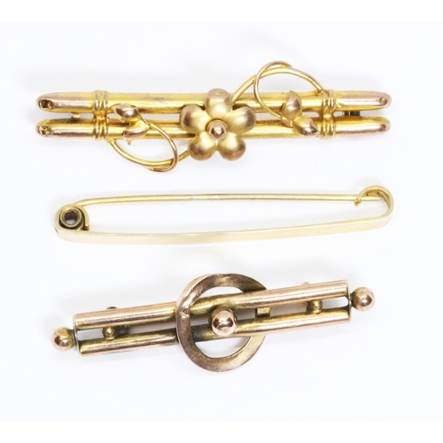 9 - A group of three bar brooches; one hallmarked 9ct gold, one marked '9ct' and one unmarked, gross wei... 