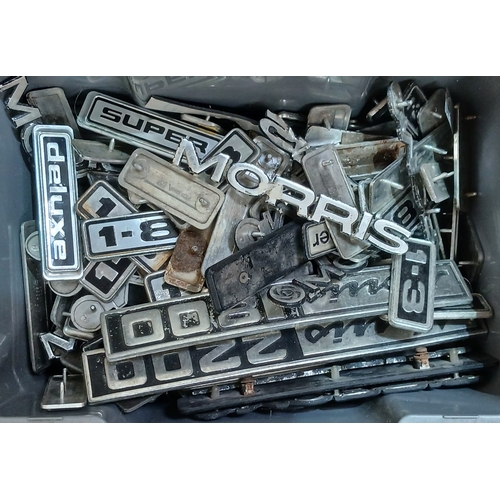 190 - A box of assorted classic car badges.