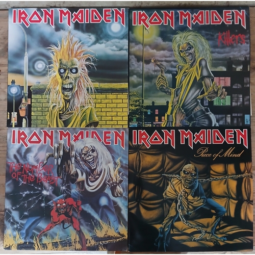 319 - Iron Maiden - a group of the first four LPs, reissues.