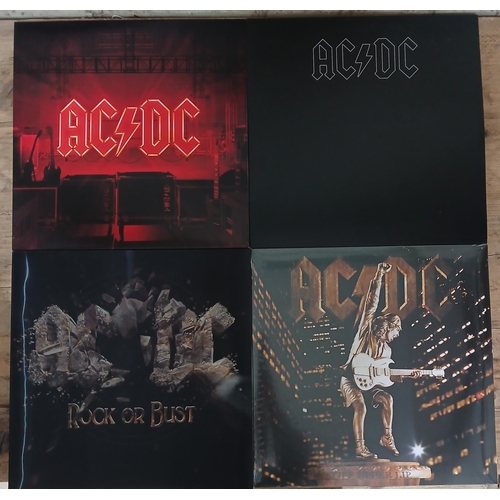 328 - AC/DC - a group of four assorted LPs.