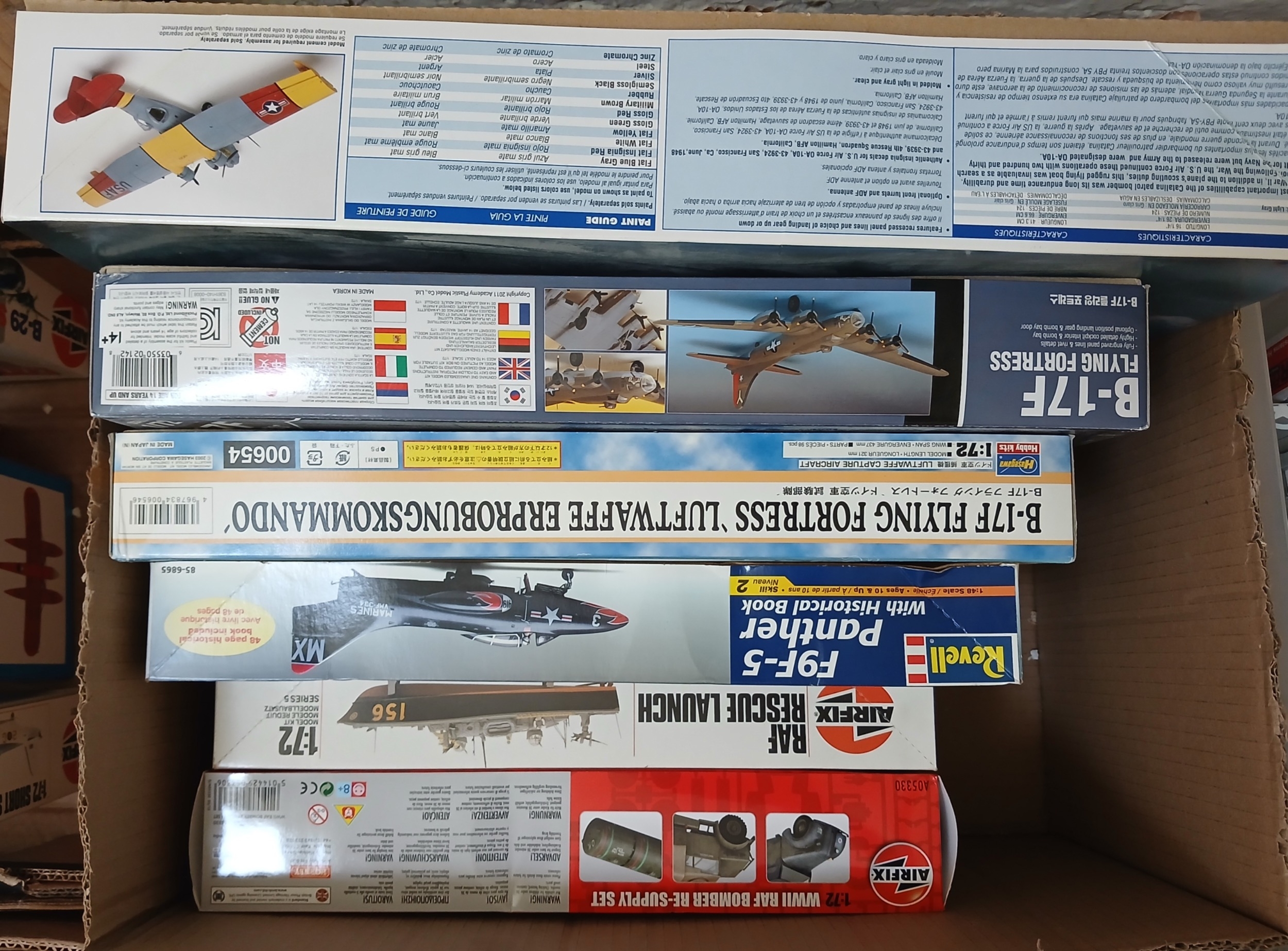 A box of unbuilt model kits.