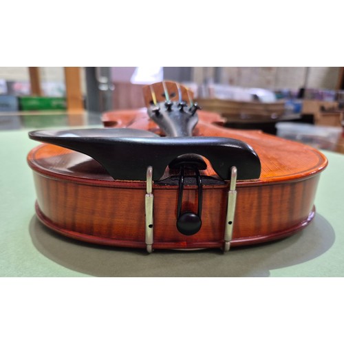 421 - A Chinese Stentor Arcadia student violin, together with bow signed 'Arnold Voigt' and hard case.