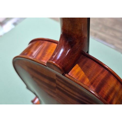 421 - A Chinese Stentor Arcadia student violin, together with bow signed 'Arnold Voigt' and hard case.