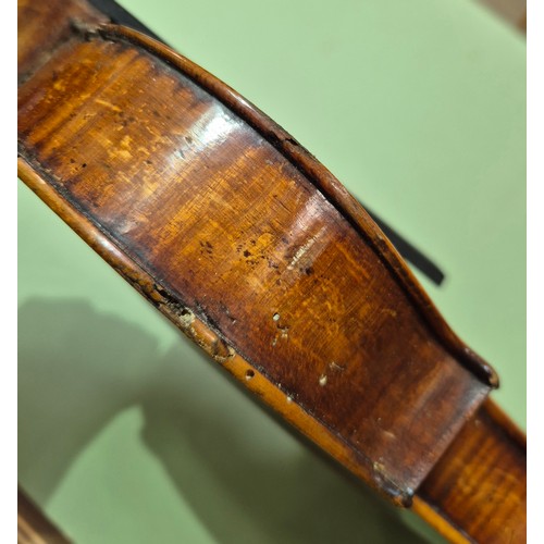 423 - An antique violin (AF) with hard case and bow.