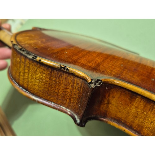 423 - An antique violin (AF) with hard case and bow.