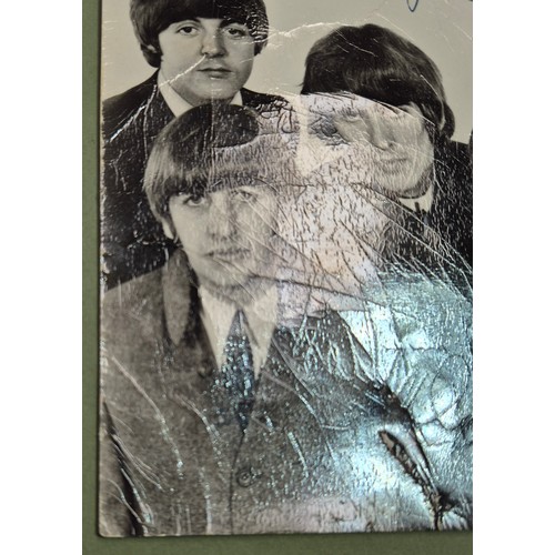 412 - The Beatles, an autographed black and white photograph, autopen facsimiles to front 'Paul Ringo Geor... 