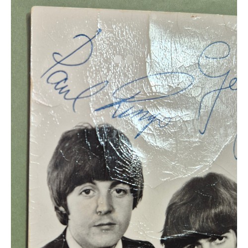 412 - The Beatles, an autographed black and white photograph, autopen facsimiles to front 'Paul Ringo Geor... 