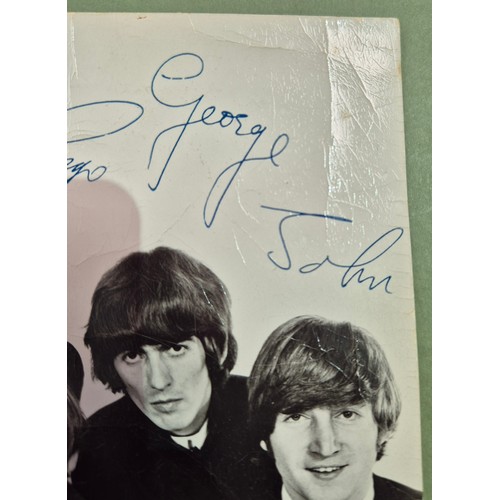 412 - The Beatles, an autographed black and white photograph, autopen facsimiles to front 'Paul Ringo Geor... 