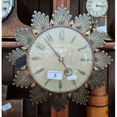 3 - A Metamec battery operated wall clock with brass effect starburst frame