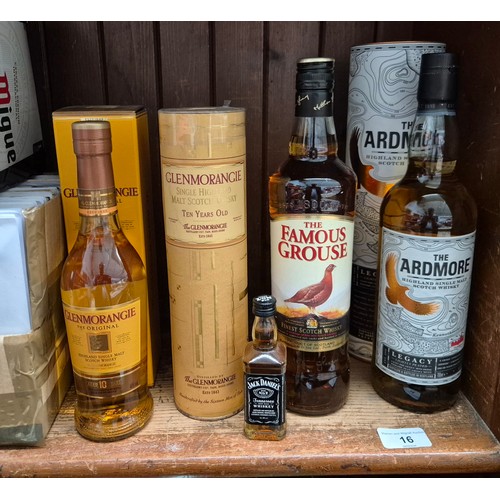 16 - Five bottles of assorted whisky and a miniature Jack Daniels