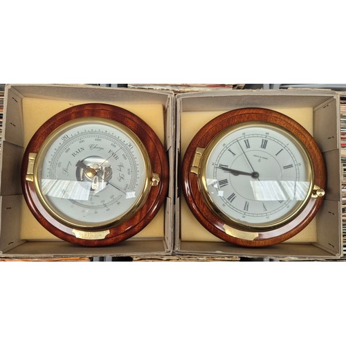 30 - A presentation clock and a barometer with wooden surrounds, by Committi London