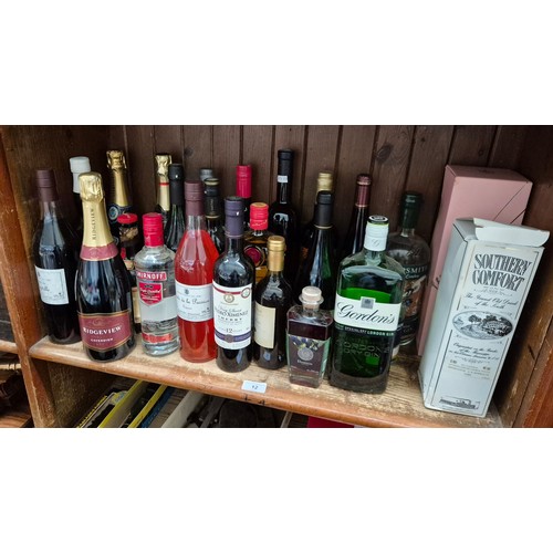 12 - Approx 25 bottles of alcohol including Southern Comfort, Gordons Gin, Smirnoff Vodka, sparkling and ... 