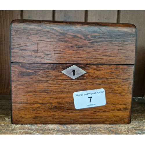 7 - A hinged wooden scent casket containing a set of three perfume bottles