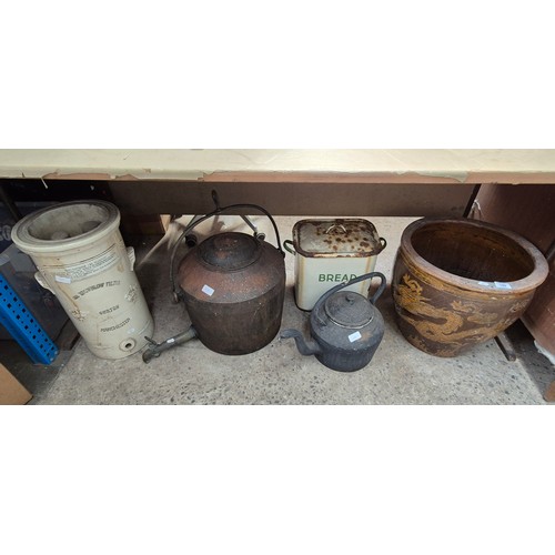 129 - A large glazed planter with dragon motif, an enamel bread bin, a heavy metal teapot, a large cast ir... 