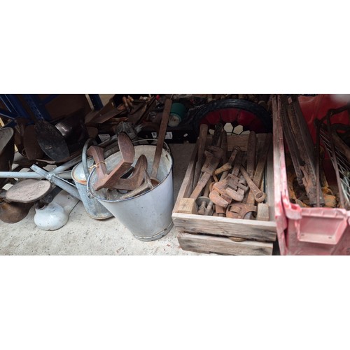 157 - 3 boxes of metalware including pickaxe heads, a box of stilsons, bucket of shoe lasts, watering cans... 