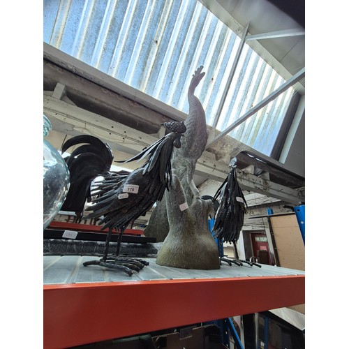 170 - A metal garden bench (in pieces),  2 metal cockerel and a metal peacock ornaments