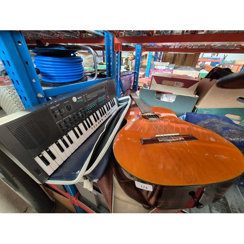 174 - A Fender Classic FC20 acoustic guitar with soft case, and a Yamaha Portasound MK100 keyboard
