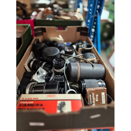 166 - A box of assorted cameras, lenses etc.