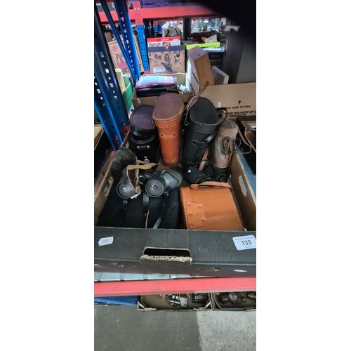 133 - A box of binoculars including Zenith, Halina etc