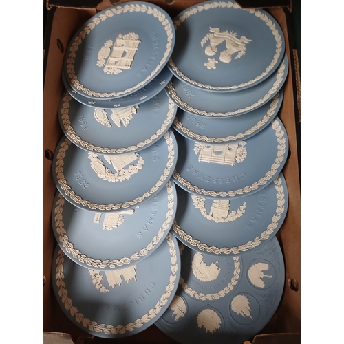 410 - A box of assorted blue Wedgwood Jasperware collector plates.