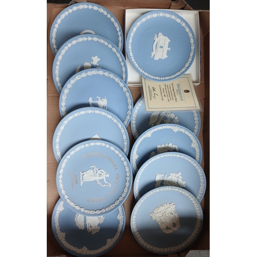 412 - A box of assorted blue Wedgwood Jasperware collector plates.