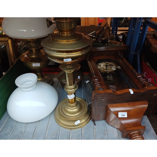 148 - A Vienna wall clock, 3 brass oil lamps with glass shades