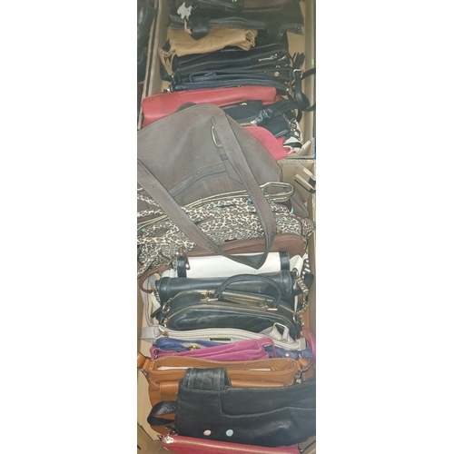 154 - Two boxes of assorted handbags to include Radley, Fiorelli, Tula & YSL etc.