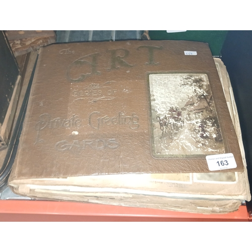163 - A vintage album containing postcards, photographs and press cuttings c1920s