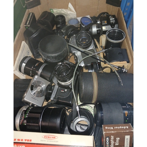 166 - A box of assorted cameras, lenses etc.