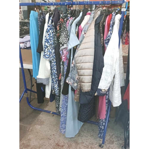 241 - A selection of ladies dresses, approx: 90, rail included in this lot