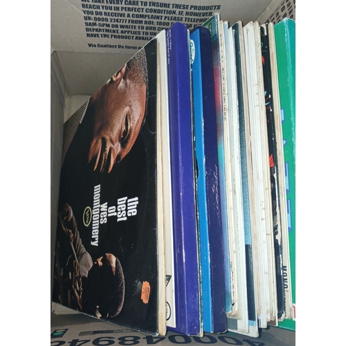 275 - A box of LPs including Wes Montgomery, Stan Getz, Louis Armstrong, Miles Davis, James & Bobby Purify... 