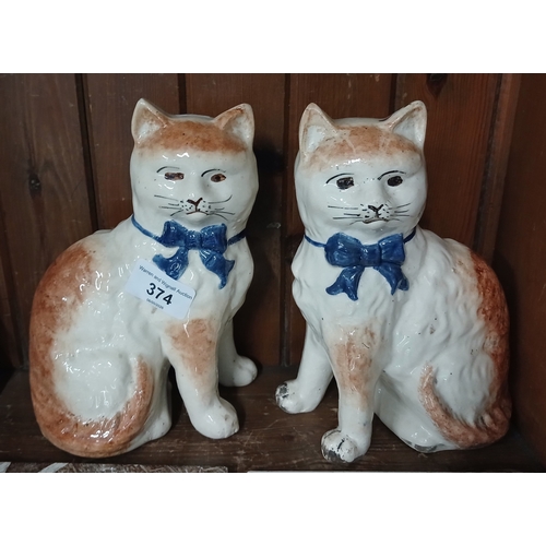 374 - pair of Staffordshire pottery cats