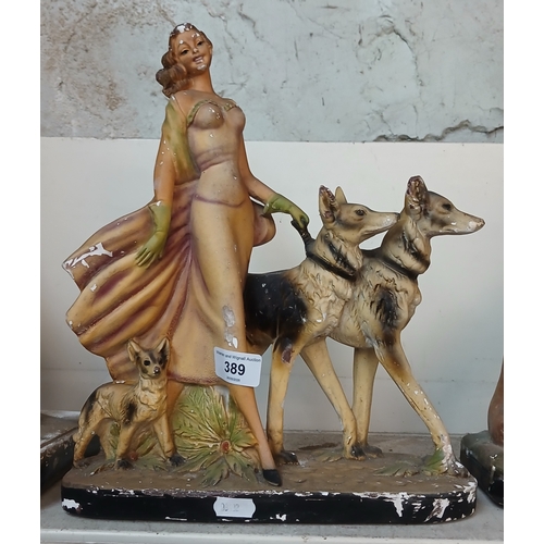 389 - Art Deco chalkware figure of lady with 3 dogs