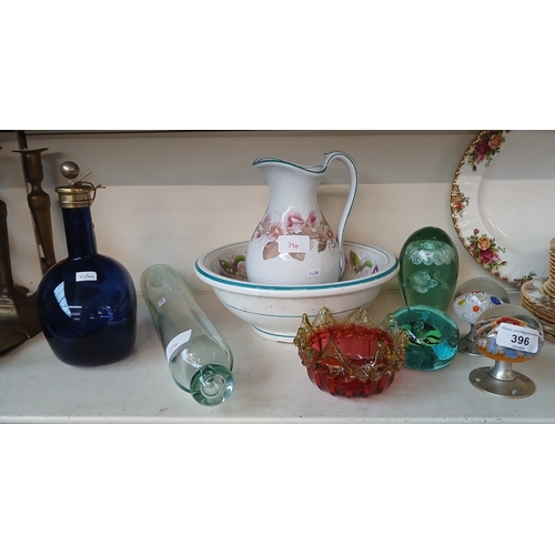 396 - A mixed lot to include a small jug and bowl set, a Bristol blue flagon, 2 millefiore paperweight doo... 