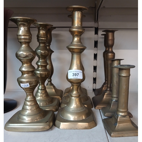 397 - 5 pairs of Georgian and Victorian brass candlesticks