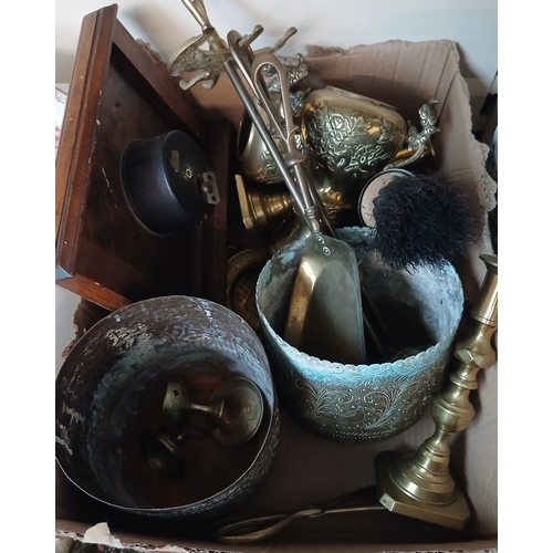 401 - A box of brass ware including fire tidy, clock, candlestick, etc