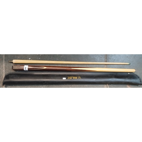 288 - A 2 piece snooker cue with inset disc with Riley, England, Stephen Hendry MBE embossed