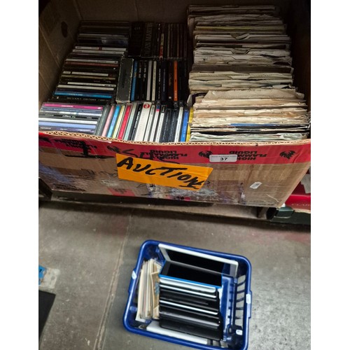 37 - A group of various items to include 45s vinyl singles, cds & various electronic devices etc.