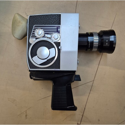 152 - A mixed lot of camera items including two telescopes, a Bolex cine camera, 35mm camera, together wit... 