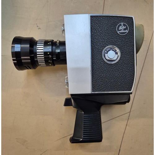 152 - A mixed lot of camera items including two telescopes, a Bolex cine camera, 35mm camera, together wit... 