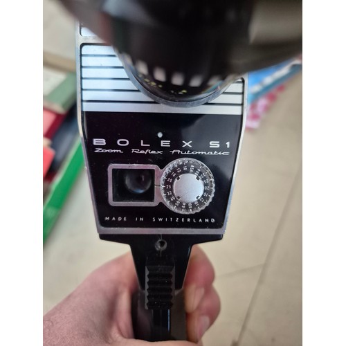 152 - A mixed lot of camera items including two telescopes, a Bolex cine camera, 35mm camera, together wit... 