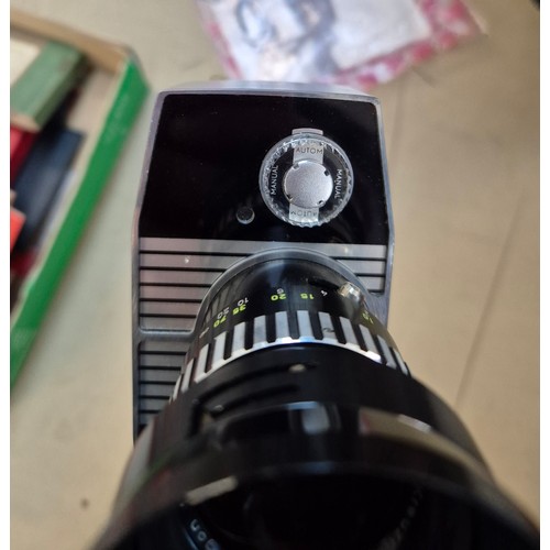 152 - A mixed lot of camera items including two telescopes, a Bolex cine camera, 35mm camera, together wit... 