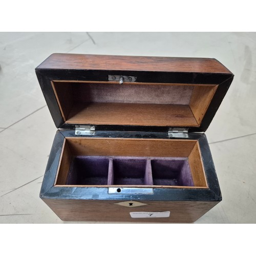 7 - A hinged wooden scent casket containing a set of three perfume bottles